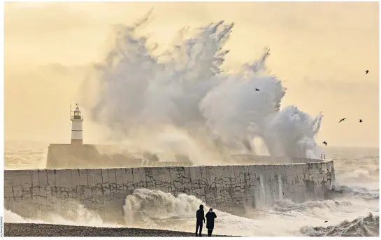  ?? ?? Waves batter Newhaven Harbour in East Sussex yesterday as Storm Isha hits the UK bringing strong winds and heavy rain across all parts of the country