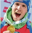  ?? Foto: dpa ?? Das Glück des Siegers: Simon Schempp nach dem Gewinn der Goldmedail­le im Massenstar­t.