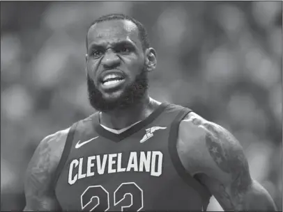  ?? The Associated Press ?? OUT IN FRONT: Cleveland forward LeBron James has words for the referees during the first half of the Cavaliers’ 128-110 victory over the Raptors Thursday in Game 2 of their second-round playoff series in Toronto.