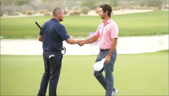  ??  ?? David Drysdale (left) shakes hands with Jorge Campillo after the Scot lost in a play-off for the Qatar Masters title