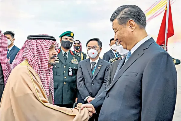  ?? ?? Xi Jinping, right, is met by Prince Faisal, Riyadh’s governor, yesterday in a visit seen by US officials as part of China’s attempt to extend global influence amid the Ukraine war and the energy crisis