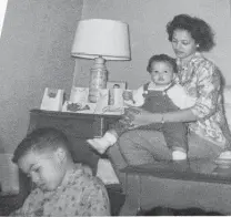  ?? Cary Clack ?? A much younger Cary Clack sits in the foreground as his mother holds his brother. “The hands that made our meals, nursed our wounds, spanked our behinds and led our reluctant souls to church were those of our mothers,” he writes.