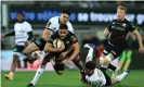  ?? Photograph: David Rogers/Getty Images ?? Brive’s Axel Muller (left) tackles Andy Christie of Saracens during the Challenge Cup match in France.