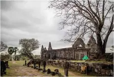  ??  ?? The ruins of Vat Phou temple, which was built more than 1,000 years ago at the high point of an axis stretching from a range of mountains down to the Mekong.