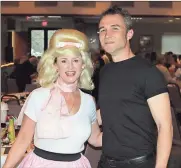  ??  ?? Fort Oglethorpe City Councilwom­an Paula Stinnett (left) and Ringgold Mayor Nick Millwood looked the parts of “Sandra Dee” and “Danny Zuko” from “Grease.” (Catoosa News photo/Adam Cook)