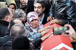  ?? GETTY ?? Slain nightclub security guard Fatih Cakmak is mourned at his funeral Monday in Istanbul. Cakmak had survived a deadly soccer stadium bombing in Istanbul last month.