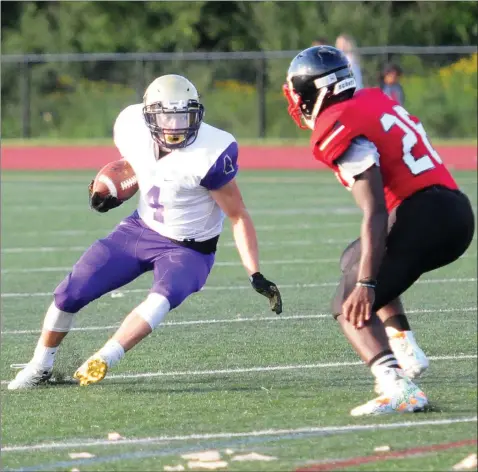  ?? Photo by Ernest A. Brown ?? St. Raphael running back Devin O’Malley (4, seen here in Friday night’s Injury Fund game win over Tolman) is one of a number of Saints who earned valuable experience playing in Division I last season. Coach Mike Sassi hopes that experience leads to a playoff spot this season.