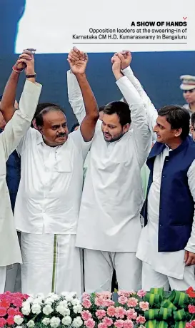  ??  ?? A SHOW OF HANDS Opposition leaders at the swearing-in of Karnataka CM H.D. Kumaraswam­y in Bengaluru