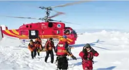  ??  ?? ANTARCTICA: In this file photo a helicopter from the Chinese National Antarctic Research Expedition or CHINARE is used to evacuate passengers, who were aboard the trapped Russian vessel MV Akademik Shokalskiy, to a safe surface off the Antarctic. — AP...