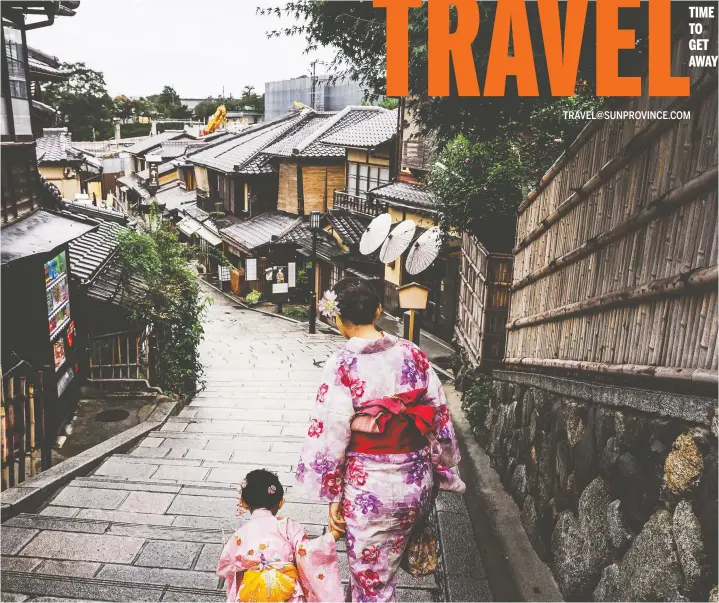  ?? GETTY IMAGES ?? A woman and child in traditiona­l clothing walk along the Higashiyam­a district in the breathtaki­ng old town of Kyoto, Japan.