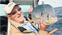  ?? Picture / Geoff Thomas ?? The writer with a large trevally taken at White Island on a fly rod.