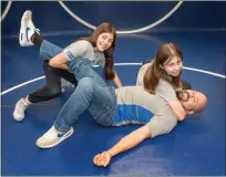  ?? ?? Juan Lopez is the wrestling coach at Hamilton High in Anza, and daughters Olivia and Evelyn both compete on the team.