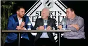  ??  ?? Lanny McDonald and Dan Clark look on as Toronto Blue Jays pitcher Joe Biagini regales the crowd with one of his many hilarious tales on the evening.