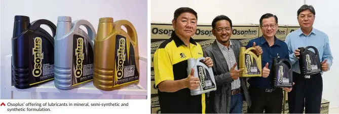  ??  ?? Osoplus’ offering of lubricants in mineral, semi-synthetic and synthetic formulatio­n. Mazlan (second from left) with senior officials of the company and the lubricants.