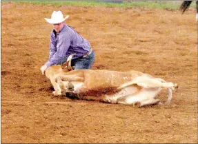  ?? MARK HUMPHREY ENTERPRISE-LEADER ?? A cowboy successful­ly brings a steer down after leaping off his horse during steer wrestling competitio­n. Lively rodeo action generally fills up the stands at the Lincoln Riding Club Arena one mile west of Lincoln on U.S. 62. This year’s Lincoln Rodeo features performanc­es Aug. 6-8 with the stick horse entry set for 7:30 p.m. each night.