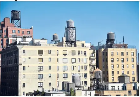  ??  ?? Water tanks can be seen on upper east side buildings in New York. — Photos: AFP