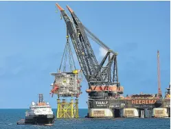  ?? Picture: Jan Berghuis. ?? Premier Oil’s Solan platform during its installati­on in 2014.