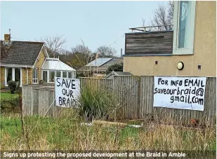  ?? ?? Signs up protesting the proposed developmen­t at the Braid in Amble