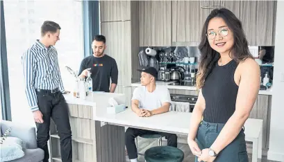  ?? NICK KOZAK PHOTOS FOR THE TORONTO STAR ?? “Roostrs,” from left, Jacob MacKinnon, Andrew Berry and Neil Robles with Maggie Shi, the co-founder of Roost Coliving.