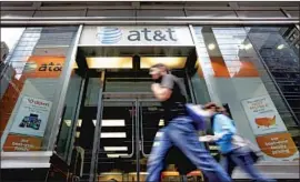  ?? Richard Drew Associated Press ?? AT&T is asserting the business mantra of “arbitratio­n is a faster, less expensive, easier means of resolving disputes.” But agreeing not to sue is not better for you.