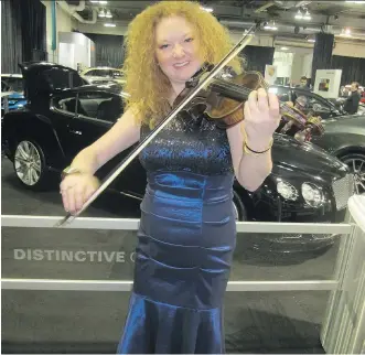  ?? PHOTOS: BILL BROOKS/ CALGARY HERALD ?? The CPO’s Roxanne Young sets the mood at An Evening of Vehicles and Violins Gala 2015, the opening night gala for the Calgary Auto and Truck Show. Glorious music, cocktails, a fundraisin­g auction and vehicles of all shapes, sizes and prices were front...