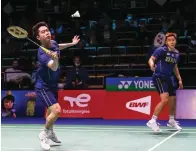  ?? BADMINTONP­HOTO ?? KURANG GARANG: Marcus/Kevin ketika menghadapi ganda Malaysia di perempat final Piala Sudirman 2021.