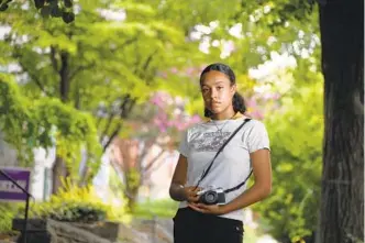  ?? KIM HAIRSTON/BALTIMORE SUN ?? Mahsati “Sunny” Moorhead, 17, a senior at Baltimore School for the Arts, in a photo taken last summer after she helped organize a Black Lives Matter march. She’s focusing on being grateful as she nears graduation, despite experience­s lost to the pandemic.