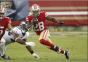  ?? NHAT V. MEYER — BAY AREA NEWS GROUP, FILE ?? Former 49ers’ running back Jerick McKinnon (28) runs with the ball against the Eagles in the second quarter during an October 2020 game Levi’s Stadium.