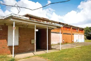  ?? The Dallas Morning News via AP ?? Melissa Pierce, a former all-black school in the Joppa neighborho­od in Dallas, is now owned by Habitat for Humanity, which is trying to determine what to to do with it.