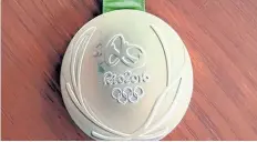  ?? KEVIN SNYDER/AP ?? This photo provided by Kevin Snyder shows the wrestler’s damaged gold metal from the 2016 Rio Olympics. Snyder is one of more than 100 athletes from around the world with defective Olympic medals.