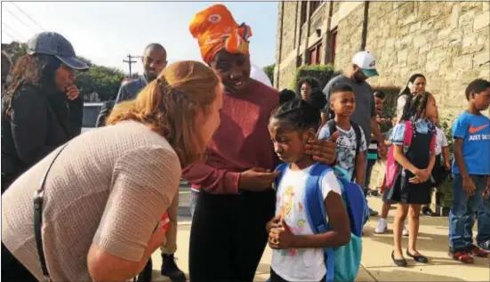  ?? KEVIN TUSTIN — DIGITAL FIRST MEDIA ?? School director Rachel Mitchell talks to Abigail Kabbah about her first day as a first-grader at Stonehurst Hills Elementary School in Upper Darby