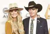  ?? EVAN AGOSTINI/INVISION ?? Lainey Wilson, left, and her father, Brian Wilson, arrive Nov. 9 at the CMA Awards in Tennessee.