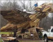  ?? BARRY TAGLIEBER — DIGITAL FIRST MEDIA ?? Volunteers put together the last bits of the wooden phoenix set up for Saturday’s Firebird Festival in Phoenixvil­le.