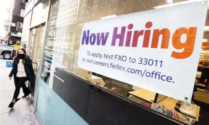  ?? ?? A sign advertisin­g job openings is seen in a store window in New York this week. Photograph: Justin Lane/EPA