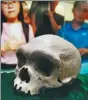  ?? ZHANG XIN / FOR CHINA DAILY ?? A fossil skull of what may be a specimen of Homo heidelberg­ensis is displayed on Wednesday.