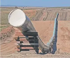  ?? | TOM STROMME/ THE BISMARCK TRIBUNE VIA AP ?? A section of the Dakota Access oil pipeline is laid in place near St. Anthony, North Dakota, in 2016.