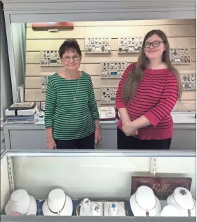  ?? Contribute­d ?? Sue Haney and Susan Willerson pose for a picture behind a counter at Haney Jewelry.