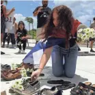  ?? EPA ?? Thousands of pairs of shoes were laid outside Puerto Rico’s Capitol in June to represent the island’s uncounted dead from Hurricane Maria.