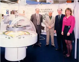  ??  ?? Opposite: Su Cox, pictured in 1990 Below & Opposite left: Company newsletter­s, which Cox edited Bottom right: At the ESE in Brussels 1996. (L-R) Mark MacDavid, Raymond Scouarnec, Des Brady and Su Cox