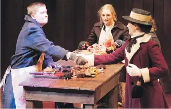  ??  ?? Lady Helena, played by Gillian McConnell, introduces herself to Victorian slaughterh­ouse workers Mary Van Den Bossche, Emma Grabinsky and Caitlin Holm in Gut Girls, at the Phoenix Theatre at UVic to Feb. 18.