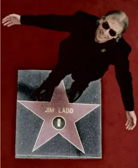  ?? PHOTOS BY REED SAXON/ASSOCIATED PRESS/FILE ?? Mr. Ladd stood on his new star on the Hollywood Walk of Fame in 2005. Below, from left: Ed Begley Jr., John Densmore, Mr. Ladd, Woody Harrelson, Robby Krieger, George Thorogood, Benmont Tench, and Jackson Browne.