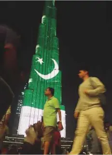  ?? Pankaj Sharma/Gulf News ?? Burj Khalifa was illuminate­d in the colours of Pakistan’s national flag yesterday evening. Residents flocked to the world’s tallest tower to see the spectacula­r LED display.