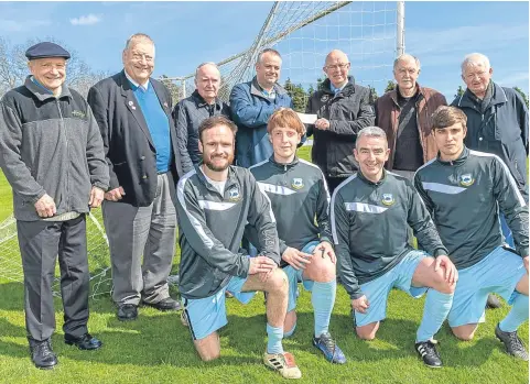  ??  ?? East Craigie received a cheque on behalf of the late Angus Adam, who was well known in junior football circles, especially at Craigie Park, where he spent many years watching form the sidelines. Pictured above are East Craigie officials and players along with friends of Angus, including the Morgan Academy ‘Class of ’42’.