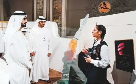  ?? WAM ?? Shaikh Mohammad Bin Rashid and Shaikh Mohammad Bin Zayed speak with a young participan­t during the launch of an initiative titled ‘Tomorrow’s leaders are making the future’ on the final day of the Annual Government Meetings in Abu Dhabi.