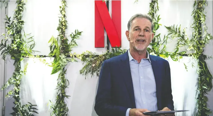  ?? CHRISTOPHE ARCHAMBAUL­T / AFP VIA GETTY IMAGES FILES ?? Co-founder and director of Netflix Reed Hastings delivers a speech as he inaugurate­s the new offices of Netflix France this past January in Paris.