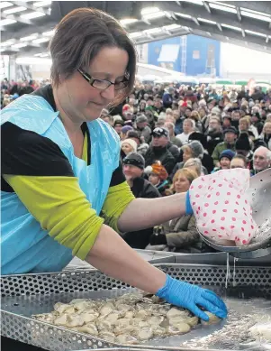  ?? PHOTO: JANETTE GELLATLY ?? Shucks, it is that time of year again . . . Alaina Oakley, of Invercargi­ll, counts the shucked oysters during the oysteropen­ing heats at the 2017 Bluff Oyster & Food Festival.