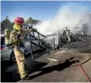  ??  ?? Firefighte­rs put out a blaze on Vogel St in Palmerston North.