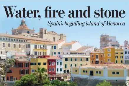  ?? ALBERT STUMM VIA AP ?? This photo shows colorful buildings Mahon, the capital of Menorca, Spain. A British influence lingers in the city, a holdover from 18th century rule that greatly benefited the island.