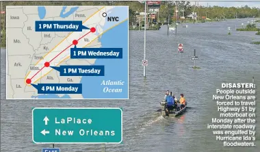  ??  ?? DISASTER: People outside New Orleans are forced to travel Highway 51 by motorboat on Monday after the interstate roadway was engulfed by Hurricane Ida’s floodwater­s.