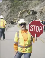  ?? JESSICA BIRO — CALTRANS ?? Guzzie keeps traffic flowing around one of this winter’s landslides along Highway 1.